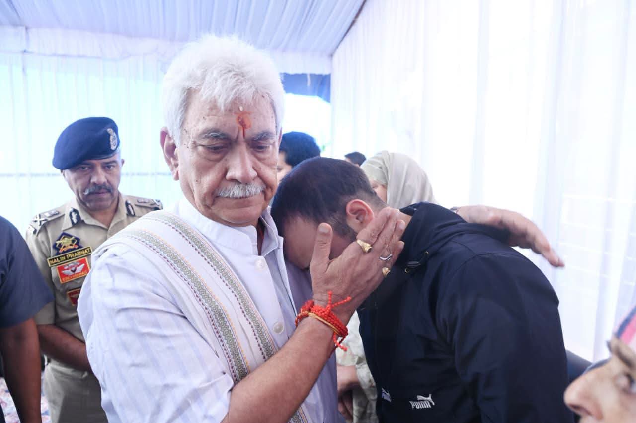 LG Sinha visits family of cop killed in Anantnag, assures full support